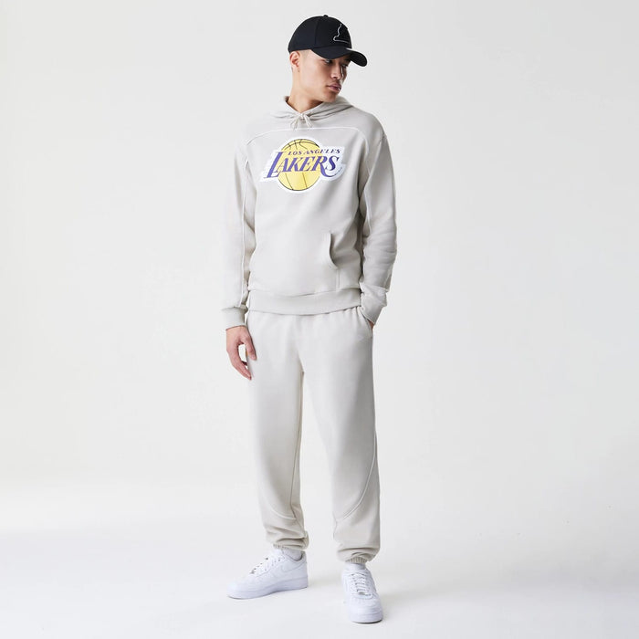 The Male model is wearing LA Lakers NBA Piping Cream Oversized Pullover Hoodie 8