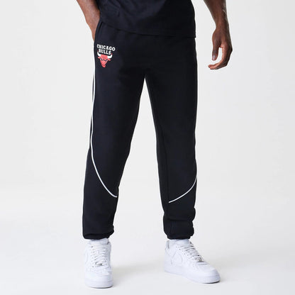 The Male model is wearing Chicago Bulls NBA Piping Navy Joggers 1