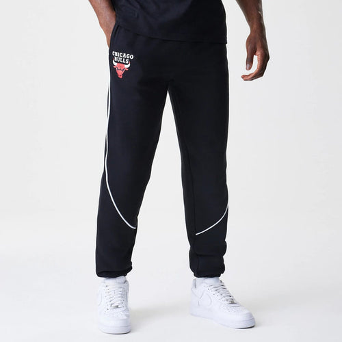 The Male model is wearing Chicago Bulls NBA Piping Navy Joggers 1