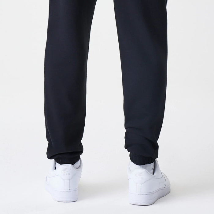 The Male model is wearing Chicago Bulls NBA Piping Navy Joggers 7