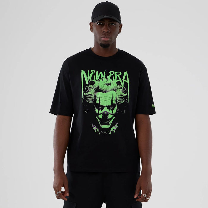 The Male model is wearing  New Era Halloween Clown Graphic Black Oversized T-Shirt 1