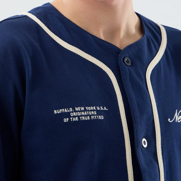 The model is wearing this New Era Oceanside Jersey in blue. 3