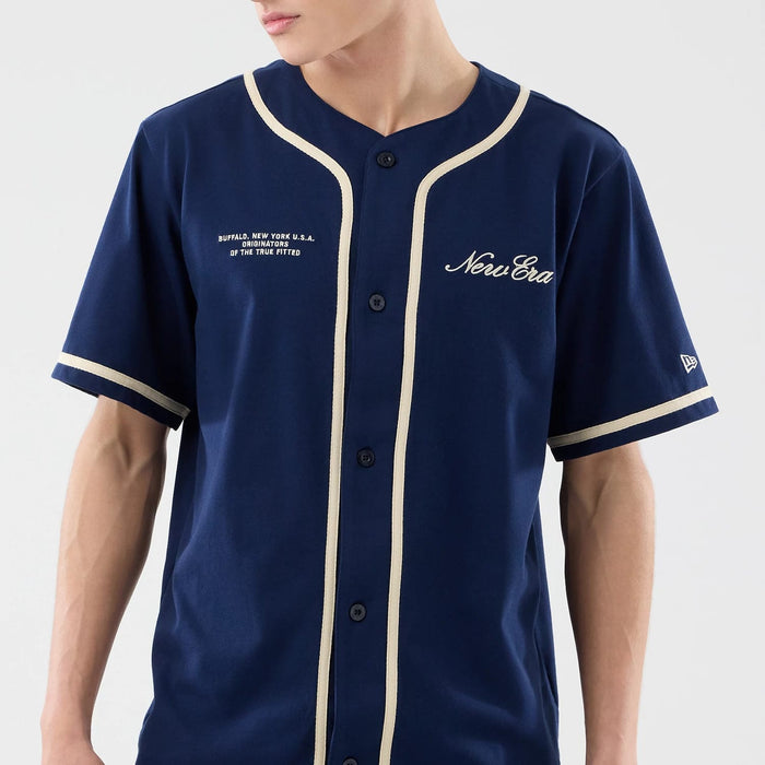 The model is wearing this New Era Oceanside Jersey in blue. 5