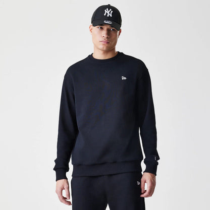 The Male model is wearing New Era Premium Essential Black Oversized Crew Neck Sweater 1