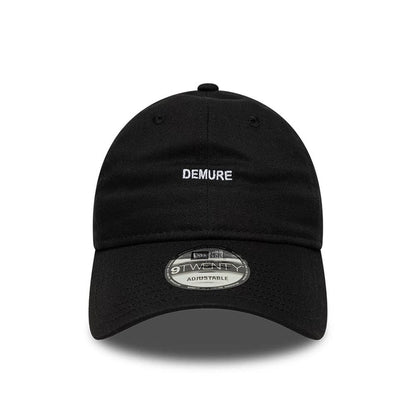This is a  New Era Slogan Demure Black 9TWENTY Adjustable Cap 2