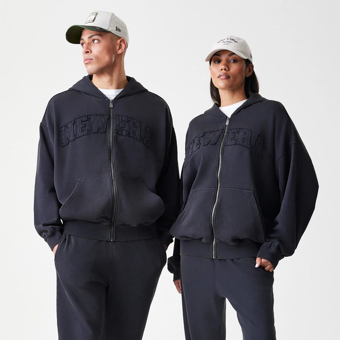 The Male model is wearing  New Era Washed Black Oversized Full Zip Hoodie 8