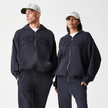 The Male model is wearing  New Era Washed Black Oversized Full Zip Hoodie 8