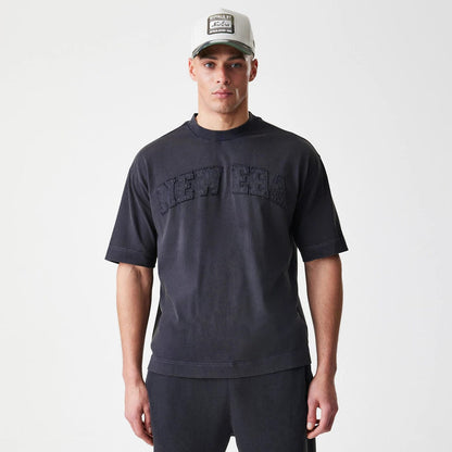 The Male model is wearing  New Era Washed Black Oversized T-Shirt 3