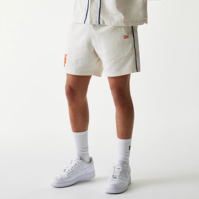 The Male model is wearing New York Mets MLB Piping Open Cream Shorts 1