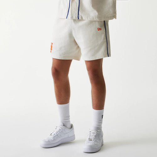 The Male model is wearing New York Mets MLB Piping Open Cream Shorts 1