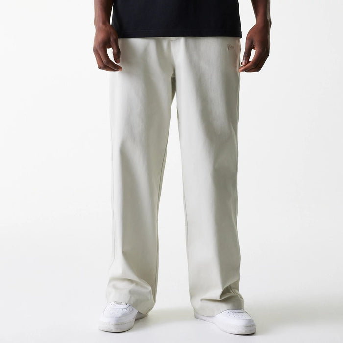 The Male model is wearing New York Yankees MLB Light Beige Chino Trousers 1