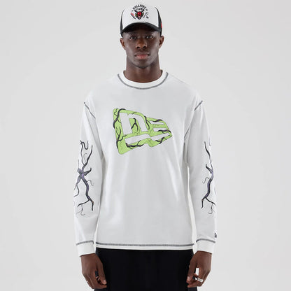 The Male model is wearing Stranger Things White Oversized Long Sleeve T-Shirt 1